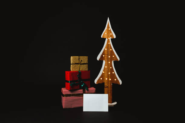 istock Christmas presents under a Christmas tree with a copy space card 1290711269