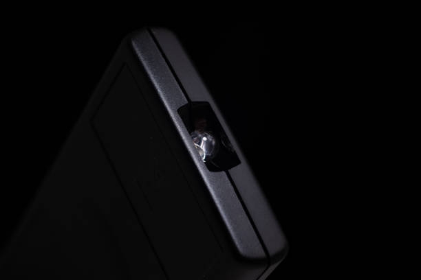 istock Black plastic remote controle with infra red emiting cell macro close up shot isolated 1290714626