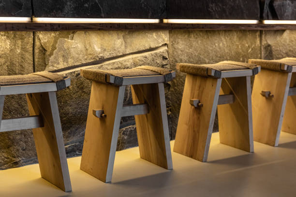 istock wooden chairs with rope and stone wall at bar 1290715964