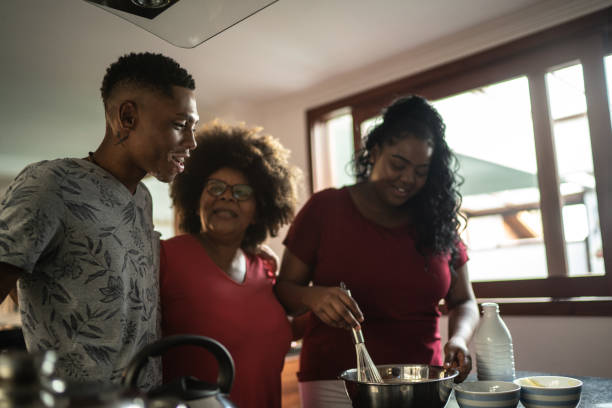 istock Mother baking cake with daughter and son at home 1290716660