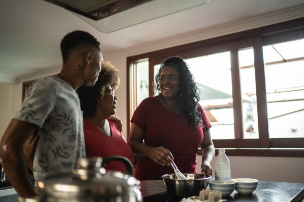 istock Mother baking cake with daughter and son at home 1290717394