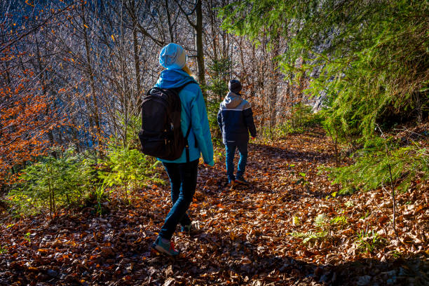 Mother and her son hiking.