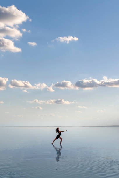 istock Ballerina dancing on the water 1290721342