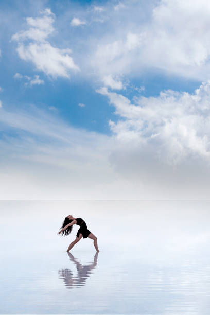 istock Ballerina dancing on the water 1290721343