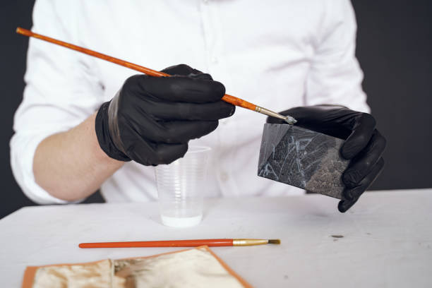 istock Man in a white shirt works with a cement 1290721953