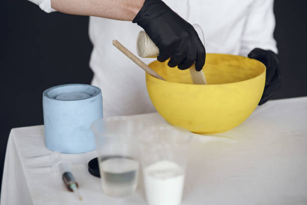 istock Man in a white shirt works with a cement 1290722100