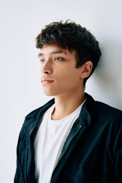 istock Close up portrait of young mixed race man on white studio background 1290725200