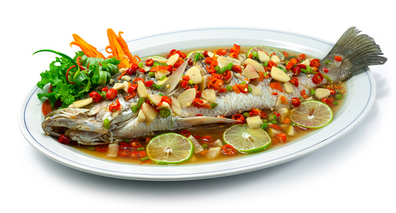 Steamed Sea bass Snapper Fish with Lime Sauce hot and Spicy Thaifood style sideview