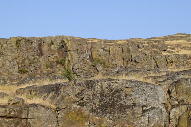 istock Rough Rocky Terrain Against Clear Sky 1290726108