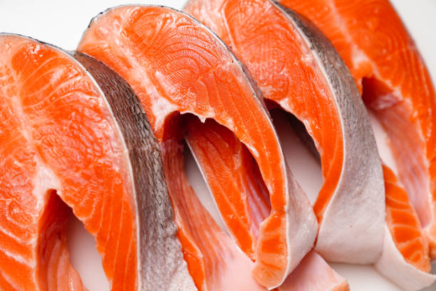 istock salmon sliced into pieces on white background. red fish. 1290727464