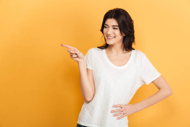 istock Young emotional woman pointing. 1290727540