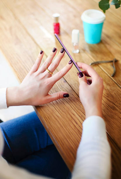 istock Woman making manicure at home 1290727752