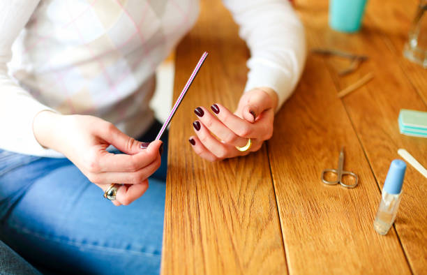istock Woman making manicure at home 1290727766