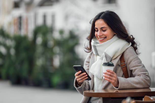 istock Holding cup of coffee, standing outside, warm weather. 1290727892