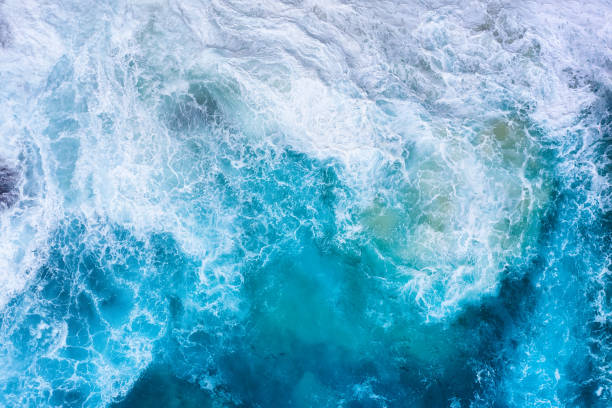 istock Ocean waves as a background. Blue water background from top view. Seacape from drone. Bali, Indonesia. Travel image 1290730552