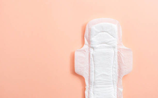 istock Sanitary pad on peach background 1290734928