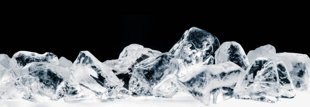 istock Pieces of crushed pure ice cubes on black background. 1290735144