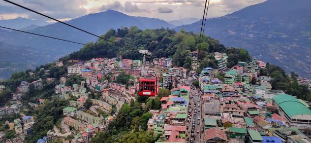 Ropeway over the city This photo was taken in Gangtok, Sikkim, India. This photo is showing the bird eye view of gangtok city. gangtok ropeway stock pictures, royalty-free photos & images