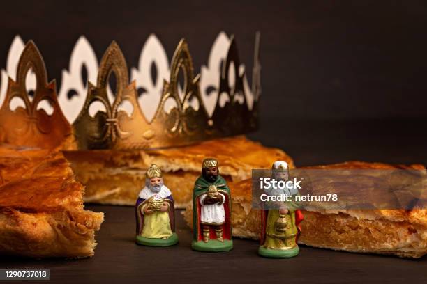 King Cake Or Galette Des Rois In French Traditional Epiphany Pie With Golden Paper Crown And Charm Stock Photo - Download Image Now