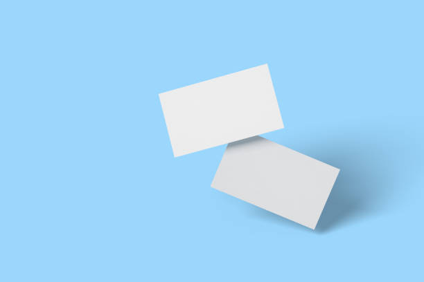 istock Blank business cards isolated on blue background. 3d illustration. 1290738245