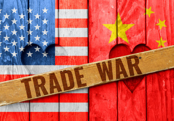 istock Wooden window shutters with USA and China flags 1290740923