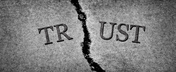 Cracked cement symbolizing broken trust between people or parties NOT TRUSTING