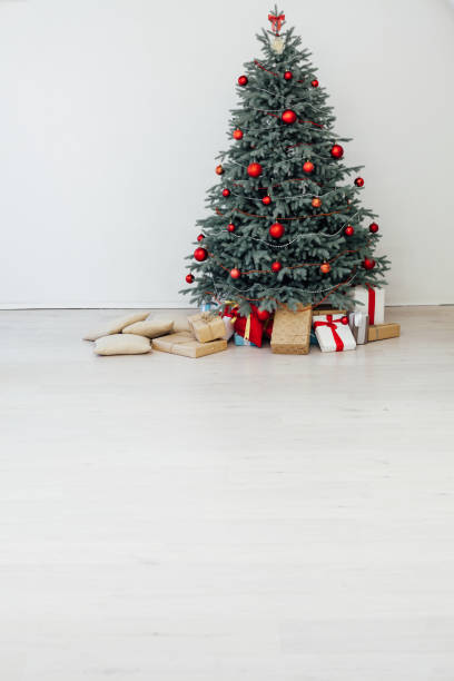 istock Beautiful holdiay decorated room with Christmas tree with presents under it 1290741131
