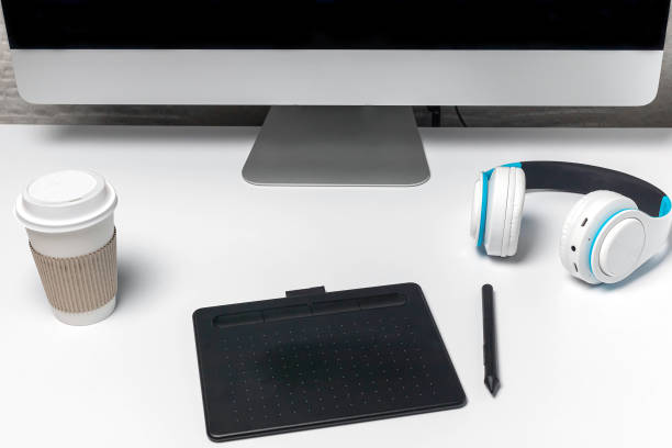istock A desktop with a desktop computer, a graphic tablet for the designer, and headphones for entertainment. 1290742439