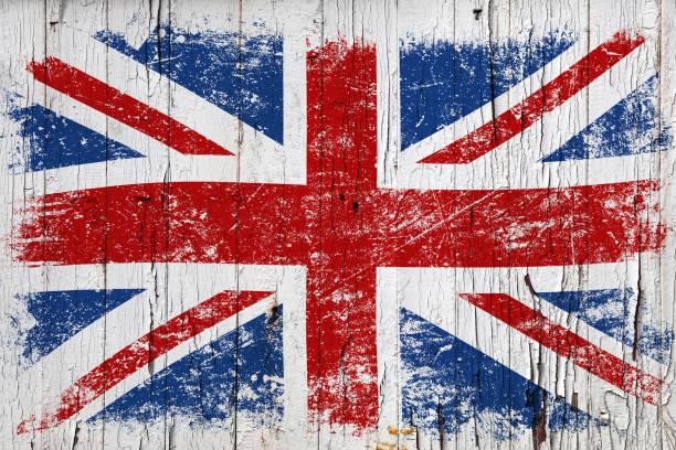 istock Grunge British flag over old white painted wood 1290743249