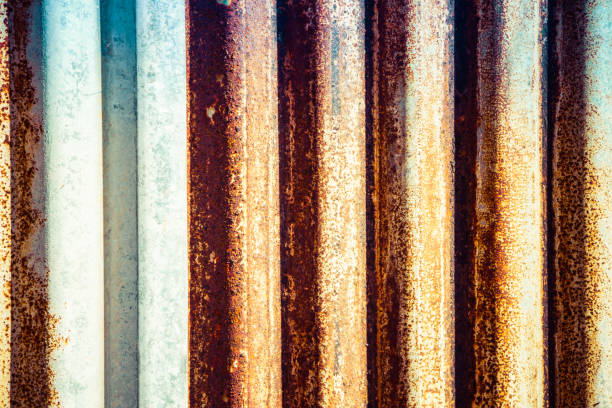 istock Rusted corrugated sheet metal siding background 1290747135