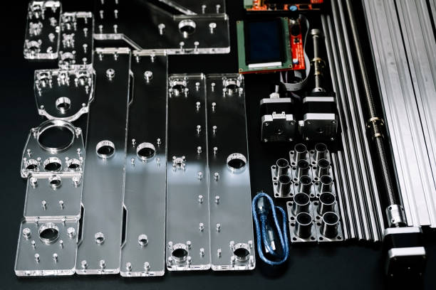 istock a set of parts for a laser machine on a black background, silver backlight, flat lay open-source hardware and software board for controlling the machine and v slot aluminum profile lies 1290748338