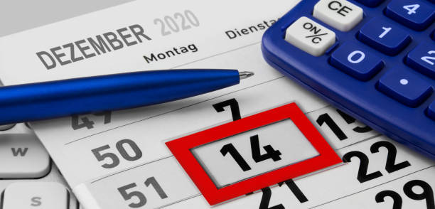 istock Dezember 14  2020 and calendar with blue calculator 1290749830