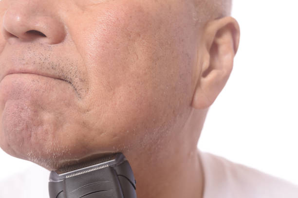 Japanese senior man shaving