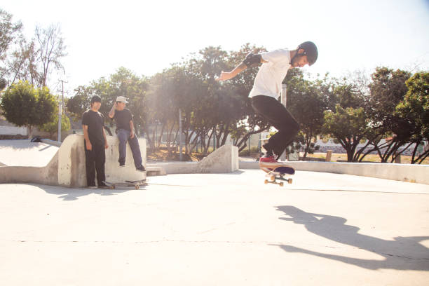 istock Friends skating in skate park 1290762845