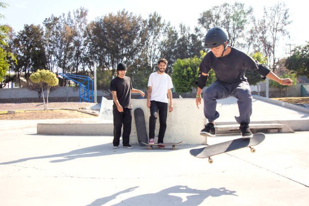 istock Friends skating in skate park 1290762846