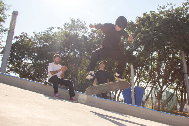 istock Friends skating in skate park 1290762875