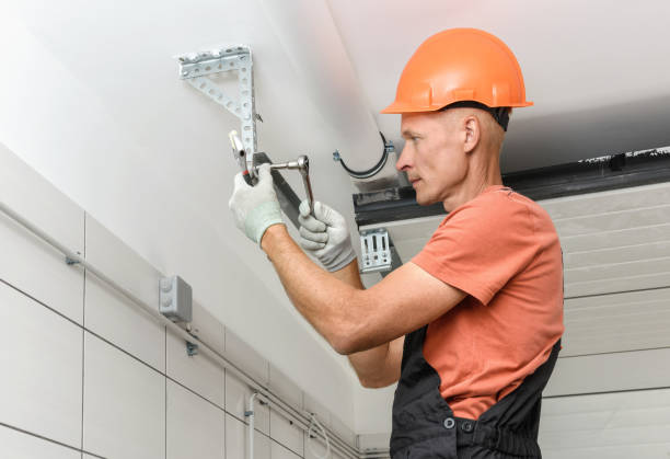 istock The worker is installing lift gates in the garage. 1290763963