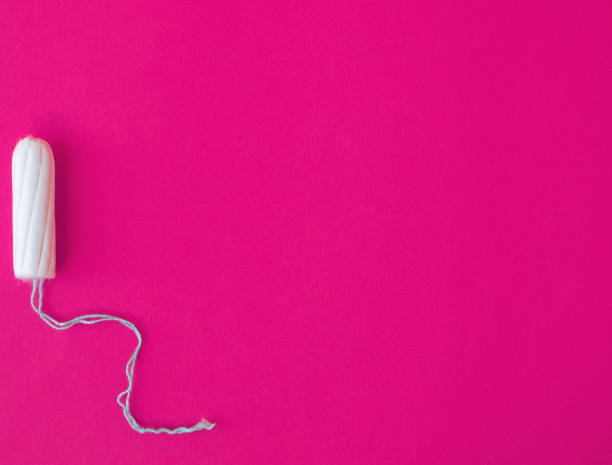 istock Hygienic tampon on a pink background. 1290764952