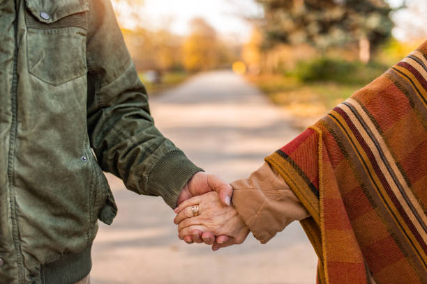 istock Romantic senior couple holding hands. 1290771003