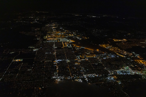 Night exposure of a city from an airplane window during a flight
