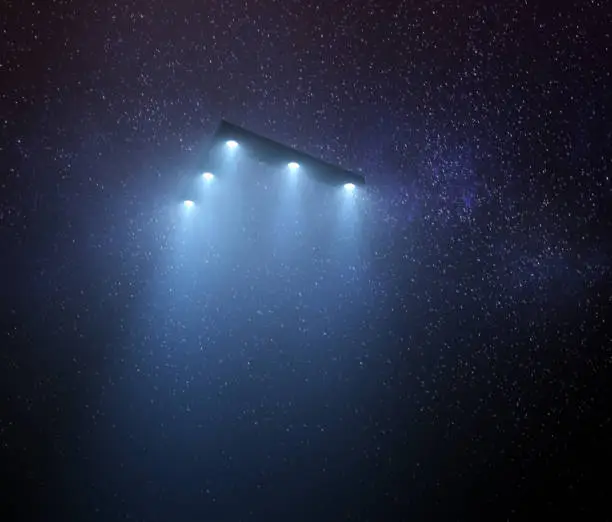 Unidentified flying object at night with fog and a light below. Triangular UFO, 3D illustration.