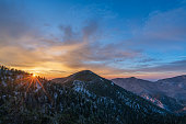 Colorful Sunrise surrounded by snowcapped mountains and the forest on Mount Charleston, Nevada