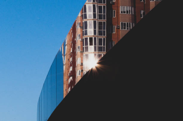 istock Modern building facade with reflections. View of a modern glass surface reflecting the buildings around 1290773599