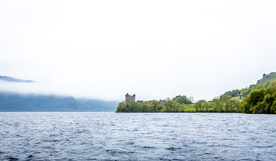 Urquhart Castle at the Loch Ness, a large, deep, freshwater loch in the Scottish Highlands southwest of Inverness, UK