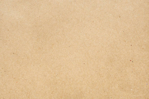 istock Brown paper recycled kraft sheet texture cardboard background 1290775271