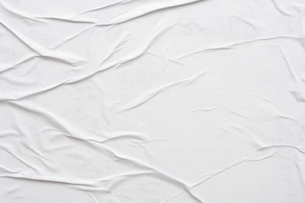 istock Blank white crumpled and creased paper poster texture background 1290775283