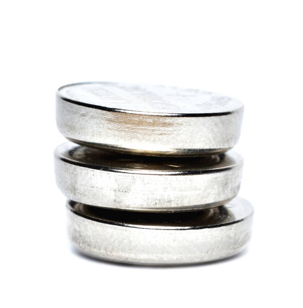 istock Button cell batteries. Watch battery isolated on white background. 1290775517
