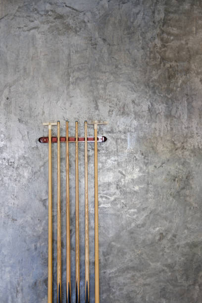 istock billiard cue sticks hang on wall 1290775775