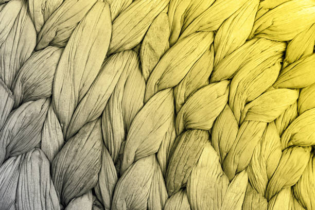 Abstract woven mat texture background yellow and gray color. Color 2021.