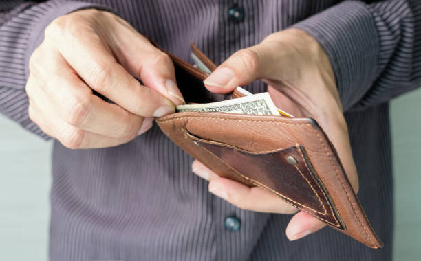istock The young man's hand opened his wallet without money. 1290786318